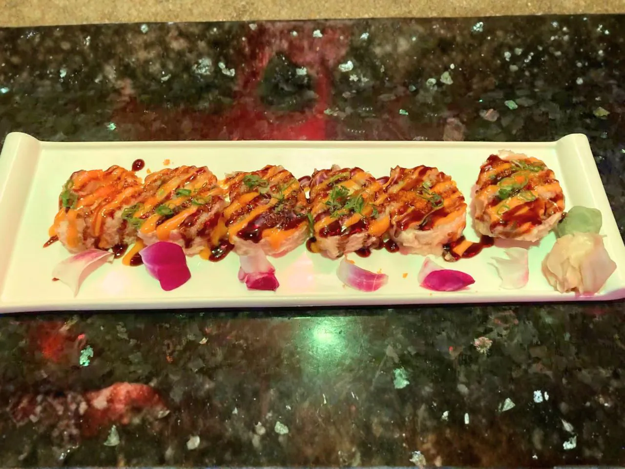 Baked sushi rolls with spicy sauce at Yamato Asian Bistro Inc, a Asian Fusion Restaurant in Spencer