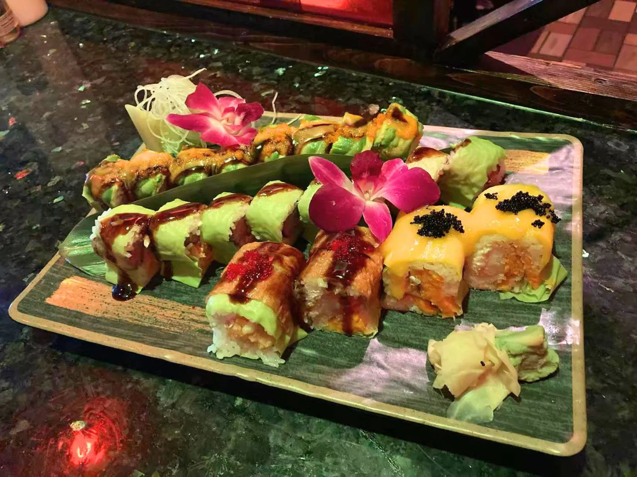 Signature sushi roll platter with garnish at Yamato Asian Bistro Inc, a Asian Fusion Restaurant in Spencer