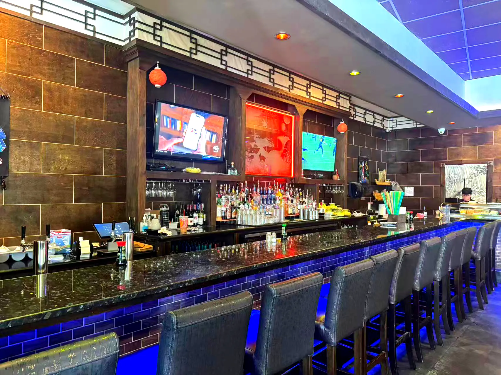 Restaurant bar interior with blue lighting at Yamato Asian Bistro Inc, a Asian Fusion Restaurant in Spencer