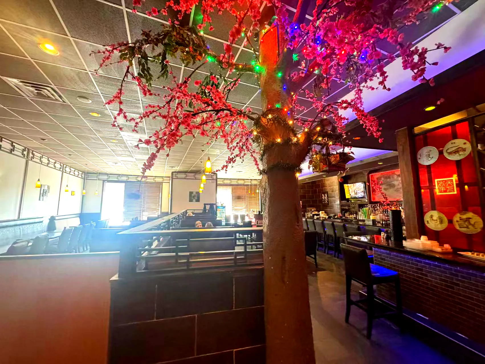 Dining area with cherry blossom decor at Yamato Asian Bistro Inc, a Asian Fusion Restaurant in Spencer